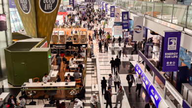 people moving in ADIPEC exhibition Halls