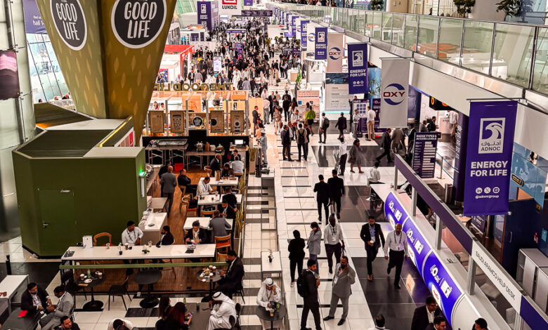 people moving in ADIPEC exhibition Halls